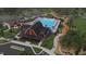 Community clubhouse with pool, walking path, and windmill at 13 Cozy Hvn, Fuquay Varina, NC 27526