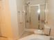 Bright bathroom with a glass-enclosed shower and a soaking tub at 1333 Beaufort Dr, Graham, NC 27253