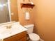 A conveniently located half bathroom with white fixtures and a small vanity at 1333 Beaufort Dr, Graham, NC 27253