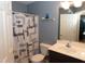 Updated bathroom with a shower with a curtain, toilet, and modern vanity sink at 1333 Beaufort Dr, Graham, NC 27253