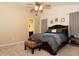 Spacious bedroom featuring a ceiling fan and a cozy bed with decorative pillows and throw at 1333 Beaufort Dr, Graham, NC 27253