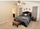 Primary bedroom boasts a king bed, ceiling fan, and en suite bathroom at 1333 Beaufort Dr, Graham, NC 27253