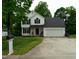 Charming two-story home features a well-maintained lawn and a two-car garage at 1333 Beaufort Dr, Graham, NC 27253