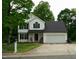 Charming two-story home features a well-maintained lawn and a two-car garage at 1333 Beaufort Dr, Graham, NC 27253