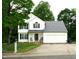 Charming two-story home featuring white siding, a covered front porch, and a well-maintained lawn at 1333 Beaufort Dr, Graham, NC 27253