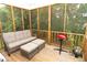 An inviting outdoor porch with a comfortable couch and grill, perfect for relaxation at 1333 Beaufort Dr, Graham, NC 27253