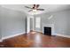 Bedroom with light gray walls, a fireplace, and hardwood floors at 134 Nelson St, Durham, NC 27707