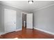 This bedroom features hardwood floors, neutral paint and trim, and great natural light at 134 Nelson St, Durham, NC 27707