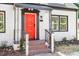 Inviting red front door with decorative details and brick steps leading to the entrance at 134 Nelson St, Durham, NC 27707