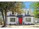 Charming two-story home featuring a red front door and a covered carport at 134 Nelson St, Durham, NC 27707