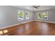 Expansive living room featuring gleaming hardwood floors and abundant natural light at 134 Nelson St, Durham, NC 27707