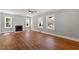 Bright living room featuring a decorative fireplace and large windows for natural light at 134 Nelson St, Durham, NC 27707
