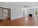 Large living room with fireplace, ceiling fan, and view to the exterior at 134 Nelson St, Durham, NC 27707
