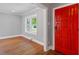 Cozy living room with hardwood floors, fresh paint, and a view of the outdoors at 134 Nelson St, Durham, NC 27707