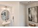 Stylish half bathroom features a modern sink, decorative mirror, and neutral decor at 136 N Finley Landing Parkway, Smithfield, NC 27577