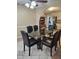 Spacious dining room with a modern glass table and stylish black chairs at 1360 Honeycutt Rd, Willow Springs, NC 27592