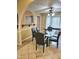 Dining room with a glass table, black chairs and access to the kitchen at 1360 Honeycutt Rd, Willow Springs, NC 27592