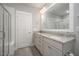 Bathroom featuring double sinks, granite countertops, and a walk-in shower at 1515 Millrock Trl, Wendell, NC 27591