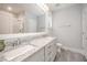 Bright bathroom featuring double sinks, granite countertops, and a walk-in shower at 1515 Millrock Trl, Wendell, NC 27591
