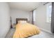 Comfortable bedroom with neutral tones, plush carpet and a window offering natural light at 1515 Millrock Trl, Wendell, NC 27591