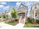 Attractive two-story home boasting a welcoming front porch, steps, and a beautifully landscaped yard at 1515 Millrock Trl, Wendell, NC 27591