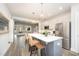 Open kitchen with a large island, stainless steel appliances, and seamless flow to adjacent living spaces for easy entertaining at 1515 Millrock Trl, Wendell, NC 27591