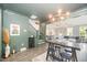 Open-concept living room showcasing stylish decor, modern lighting, and seamlessly connecting spaces in a well-lit interior at 1515 Millrock Trl, Wendell, NC 27591