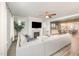 Bright living room showcasing a fireplace, ceiling fan and comfortable seating area with a neutral color palette at 1515 Millrock Trl, Wendell, NC 27591