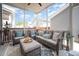 Comfortable screened patio with wicker furniture and an area rug, perfect for relaxation at 1515 Millrock Trl, Wendell, NC 27591