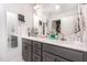 Bathroom with double vanity, gray cabinets, large mirrors, and ample counter space at 18 Hunter Fox Trl, Angier, NC 27501