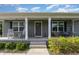 Charming front porch with rocking chairs and swing at 18 Hunter Fox Trl, Angier, NC 27501