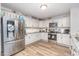 Modern kitchen with stainless steel appliances and ample counter space at 18 Hunter Fox Trl, Angier, NC 27501