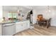Open floor plan with kitchen island bar and granite countertops at 18 Hunter Fox Trl, Angier, NC 27501