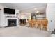 Cozy living space with fireplace and open floor plan, seamlessly connecting to the kitchen at 18 Hunter Fox Trl, Angier, NC 27501