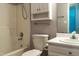Bathroom featuring a tub and shower combo, toilet, vanity, and linen cabinet at 200 Steeple Rd, Holly Springs, NC 27540