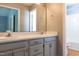 Bathroom featuring a double vanity, mirror, and access to a shower and toilet area at 200 Steeple Rd, Holly Springs, NC 27540