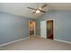 Primary bedroom with vaulted ceilings, carpet floors, and access to an ensuite bathroom at 200 Steeple Rd, Holly Springs, NC 27540