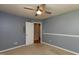 This bedroom offers a doorway, closet, ample lighting, and a ceiling fan at 200 Steeple Rd, Holly Springs, NC 27540