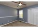 Bedroom featuring a window with natural light, a closet, and a ceiling fan at 200 Steeple Rd, Holly Springs, NC 27540