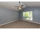 Spacious bedroom with vaulted ceilings, a large window, and neutral carpeting at 200 Steeple Rd, Holly Springs, NC 27540
