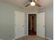 This bedroom shows two entryways, a ceiling fan, and ample natural light at 200 Steeple Rd, Holly Springs, NC 27540