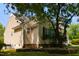 The home's exterior shows well-maintained siding, complemented by dark shutters and the surrounding greenery at 200 Steeple Rd, Holly Springs, NC 27540