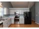 This is an image of a kitchen featuring modern stainless steel appliances, ample cabinet, and counter space at 200 Steeple Rd, Holly Springs, NC 27540