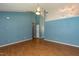 This living room offers a ceiling fan, hardwood floors, and an open layout, perfect for a comfortable living space at 200 Steeple Rd, Holly Springs, NC 27540