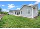 Exterior of home with grassy backyard on a sunny day at 2033 Buck Corner Ln, Fuquay Varina, NC 27526