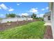 Backyard with white fence and manicured landscaping at 2033 Buck Corner Ln, Fuquay Varina, NC 27526