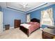 Charming bedroom with tray ceiling, complemented by classic furniture and natural light from windows at 2033 Buck Corner Ln, Fuquay Varina, NC 27526
