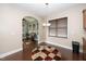 A bright dining area complemented by hardwood floors, stylish lighting, and an open layout for easy entertaining at 2033 Buck Corner Ln, Fuquay Varina, NC 27526