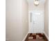 An inviting foyer with hardwood floors, stylish rug, and tasteful decor, creating a warm and welcoming entrance to the home at 2033 Buck Corner Ln, Fuquay Varina, NC 27526