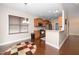 Open concept kitchen with stainless steel appliances, wood cabinets, and adjacent dining area at 2033 Buck Corner Ln, Fuquay Varina, NC 27526